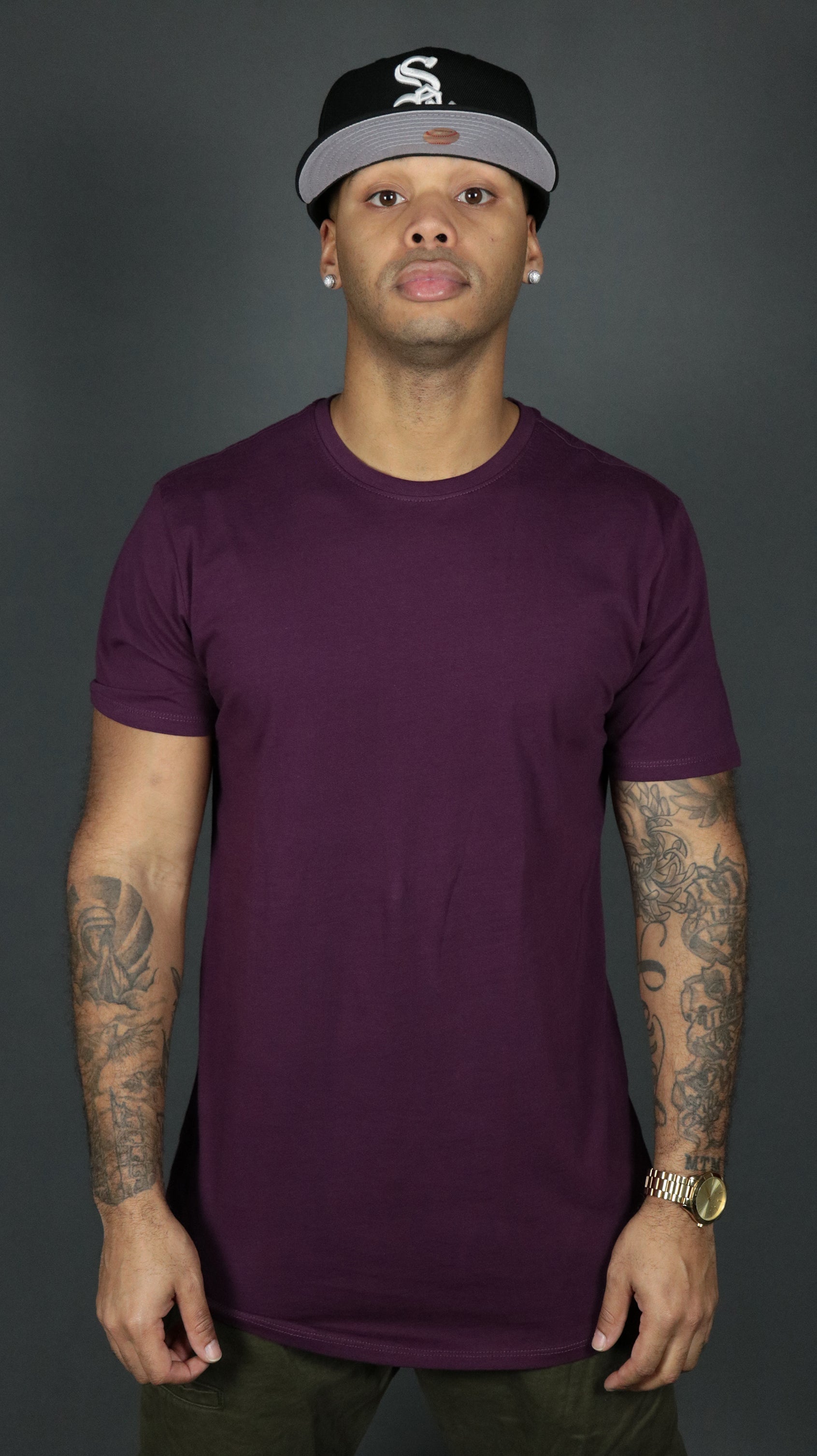 Front side of the plum Jordan Craig longline bottom scoop tshirt.