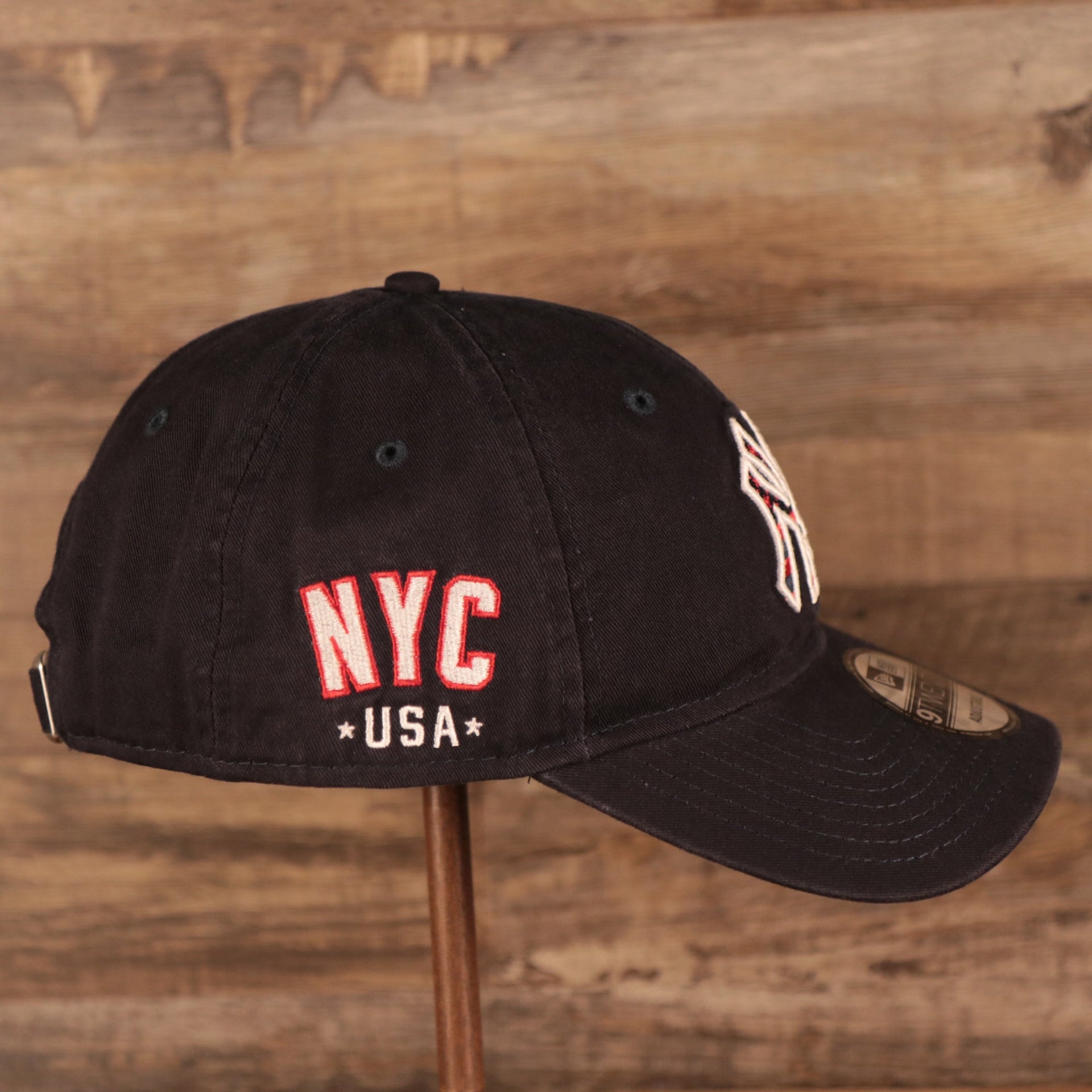 The NYC USA patch on the wearer's right side of the red MLB fourth of July 2021 New York Yankees 920 dad hat.
