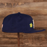 Wearer's right of the Los Angeles Dodgers All Over Floral Pattern Flower Crotchet Side Patch Pink Bottom 59Fifty Fitted Cap