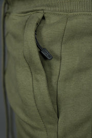 The Jordan Craig military green jogger pants has three zipped pockets.