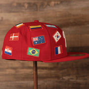 Phillies World Flags Gray Bottom Fitted Cap | Philadelphia Phillies International Flags Red Grey Under Brim Fitted Cap the wearers right side has flags from the countries of Brazil. Australia, and Colombia