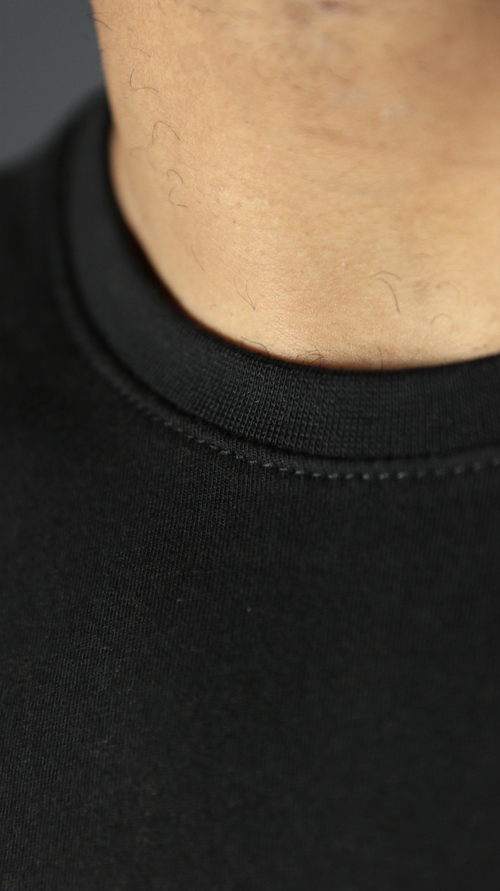 The front collar of the Jordan Craig men's scoop bottom tshirt.