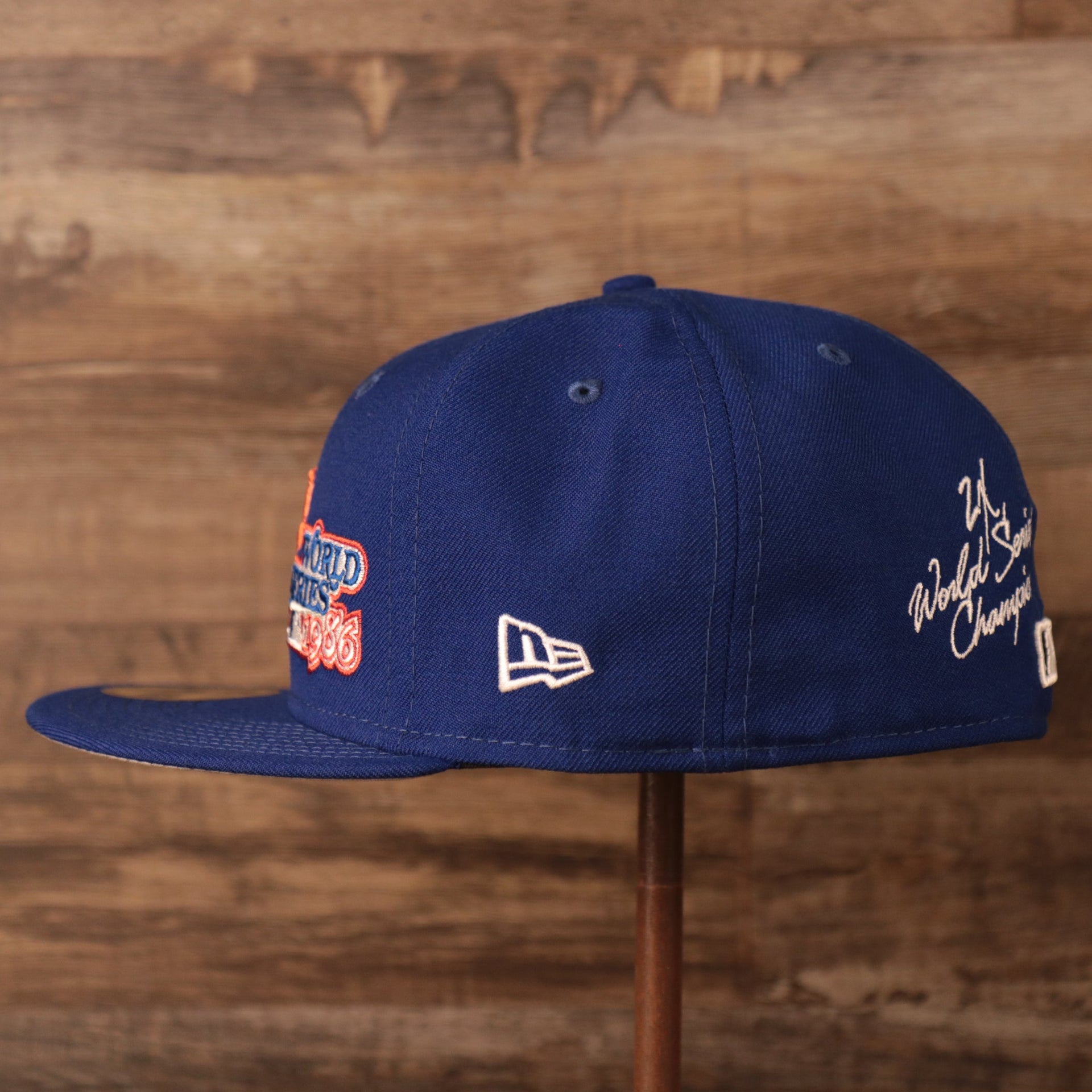 Wearer's left of the New York Mets All Over World Series Side Patch 2x Champ Gray Bottom 59Fifty Fitted Cap