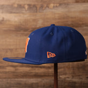 The New Era logo on the left side of the New York Mets blue fitted hat.