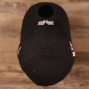 A top side view of the crown of the New York Yankees navy MLB on field fourth of July 3930 flexfit cap by New Era.