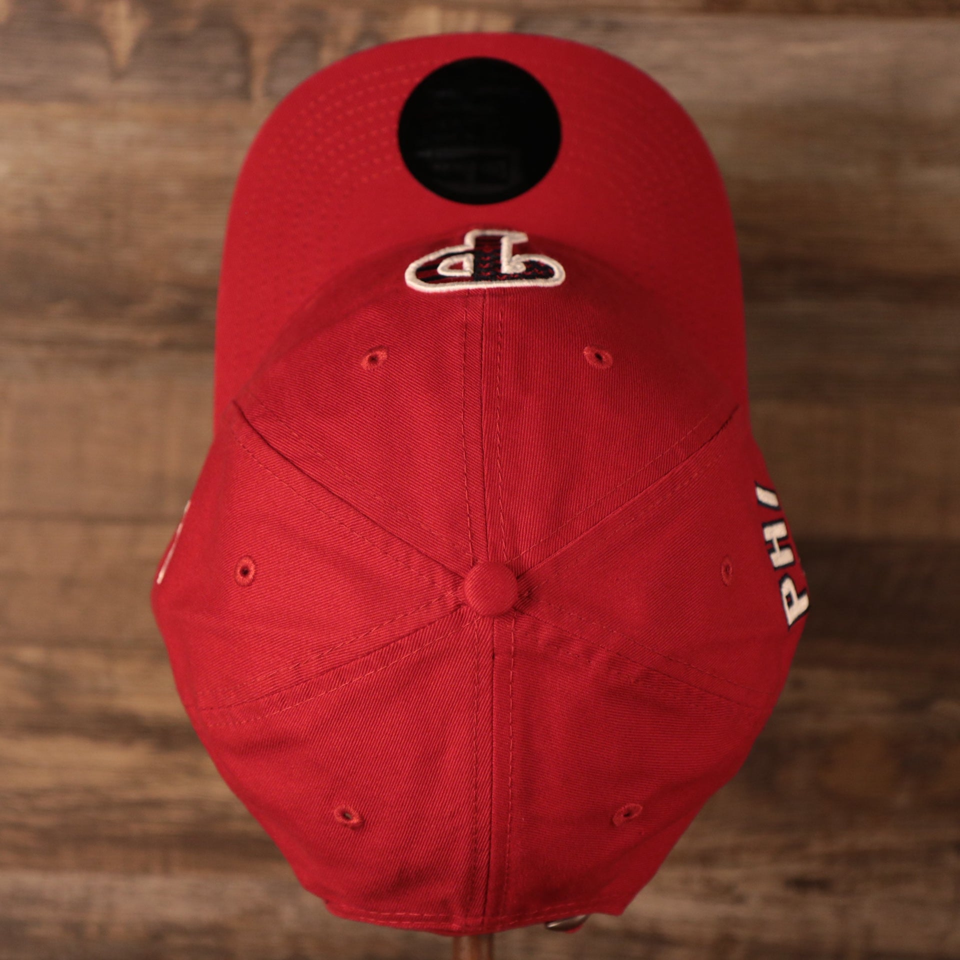A top side view of the crown of the Philadelphia Phillies red MLB on field fourth of July 9twenty dad by New Era.