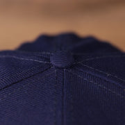 A view of the New Era blue 59fifty with an all over logo history fitted design of the hat for the Dodgers.