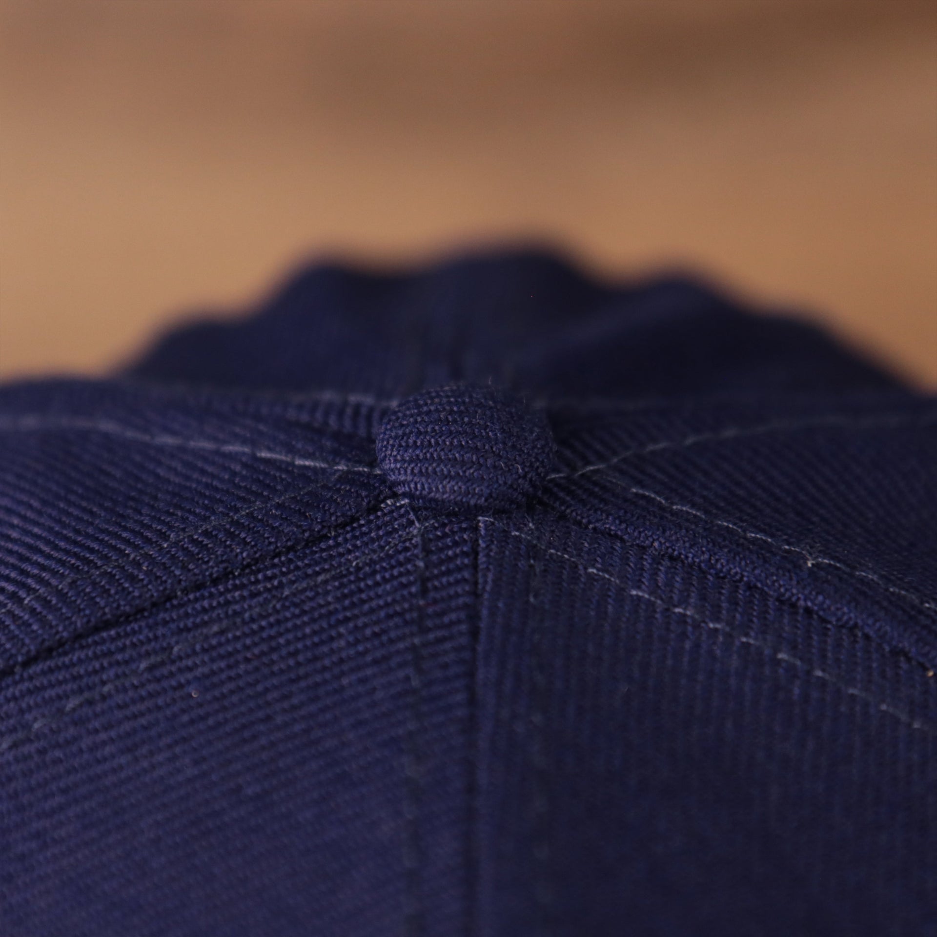 A view of the New Era blue 59fifty with an all over logo history fitted design of the hat for the Dodgers.