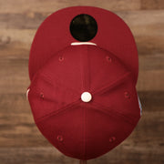 A top view of the crown of the Philadelphia Phillies white floral bottom retro maroon 59fifty hat by New Era.