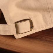 Philadelphia Athletics Royal Blue Logo Retro Cream Dad Hat Up close back strap with '47 Clean Up logo engrave on its buckle