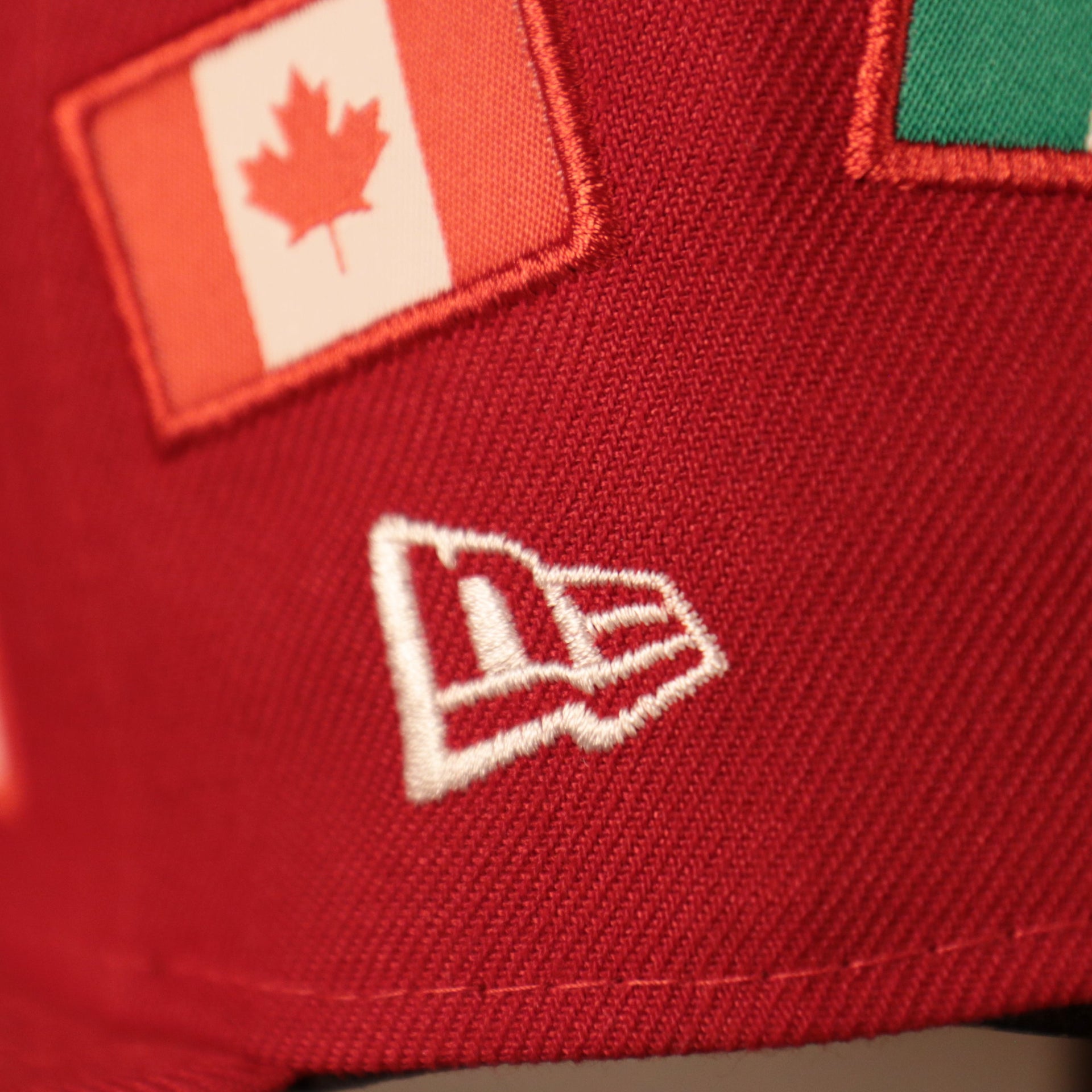 the new era logo on the side of this phillies fitted cap is white Phillies World Flags Gray Bottom Fitted Cap | Philadelphia Phillies International Flags Red Grey Under Brim Fitted Cap