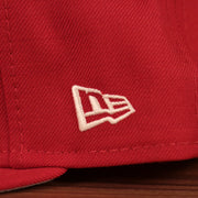The wearer's left side of the red Philadelphia Phillies Philly Cheesesteka side patch fitted hat has the white New Era logo.