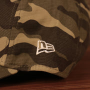 The white New Era logo on the wearer's left side of the Memorial Day 2021 3930 flexfit cap for the New York Yankees.