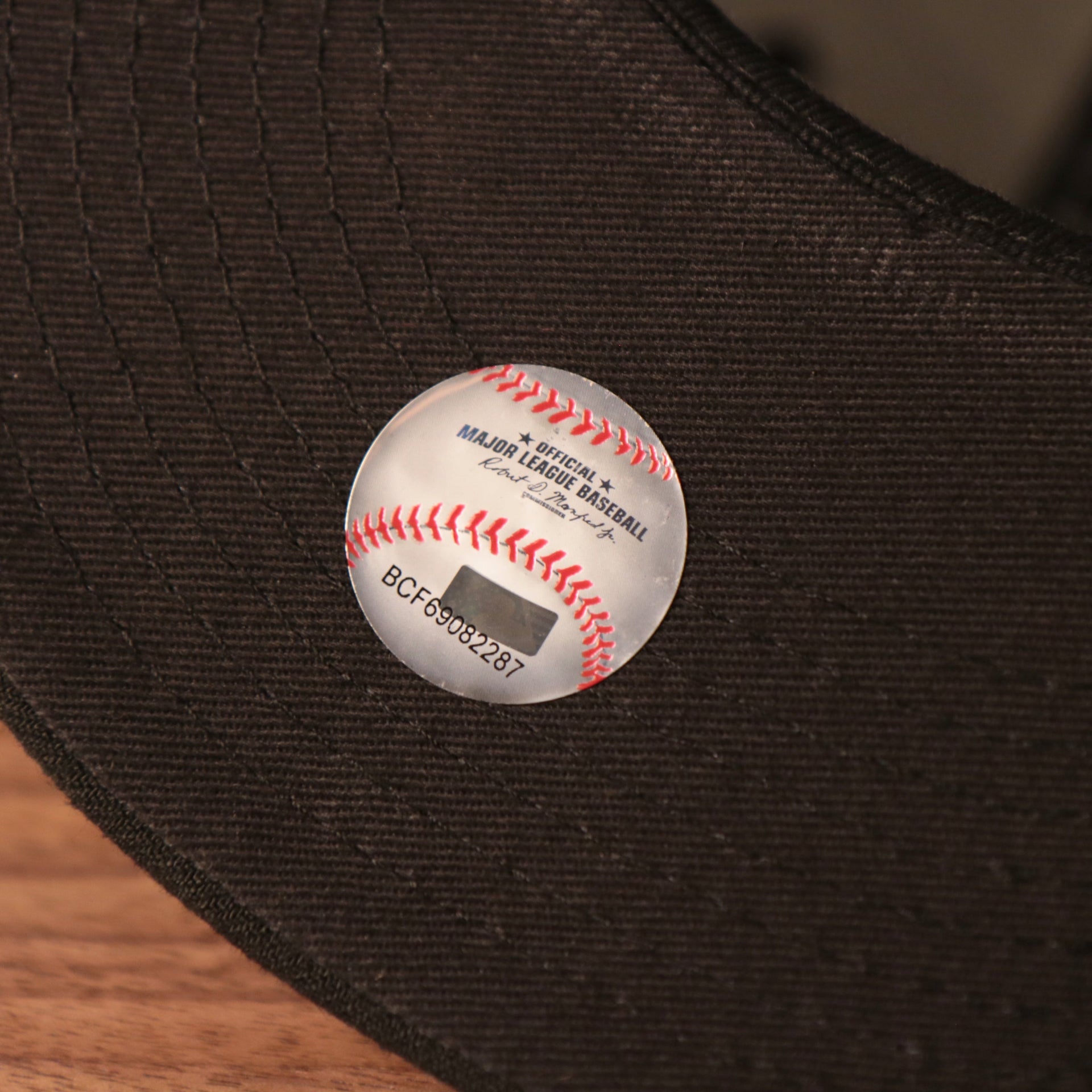 The official Major League Baseball logo on the black bottom fitted 59fifty for the Pittsburgh Pirates.