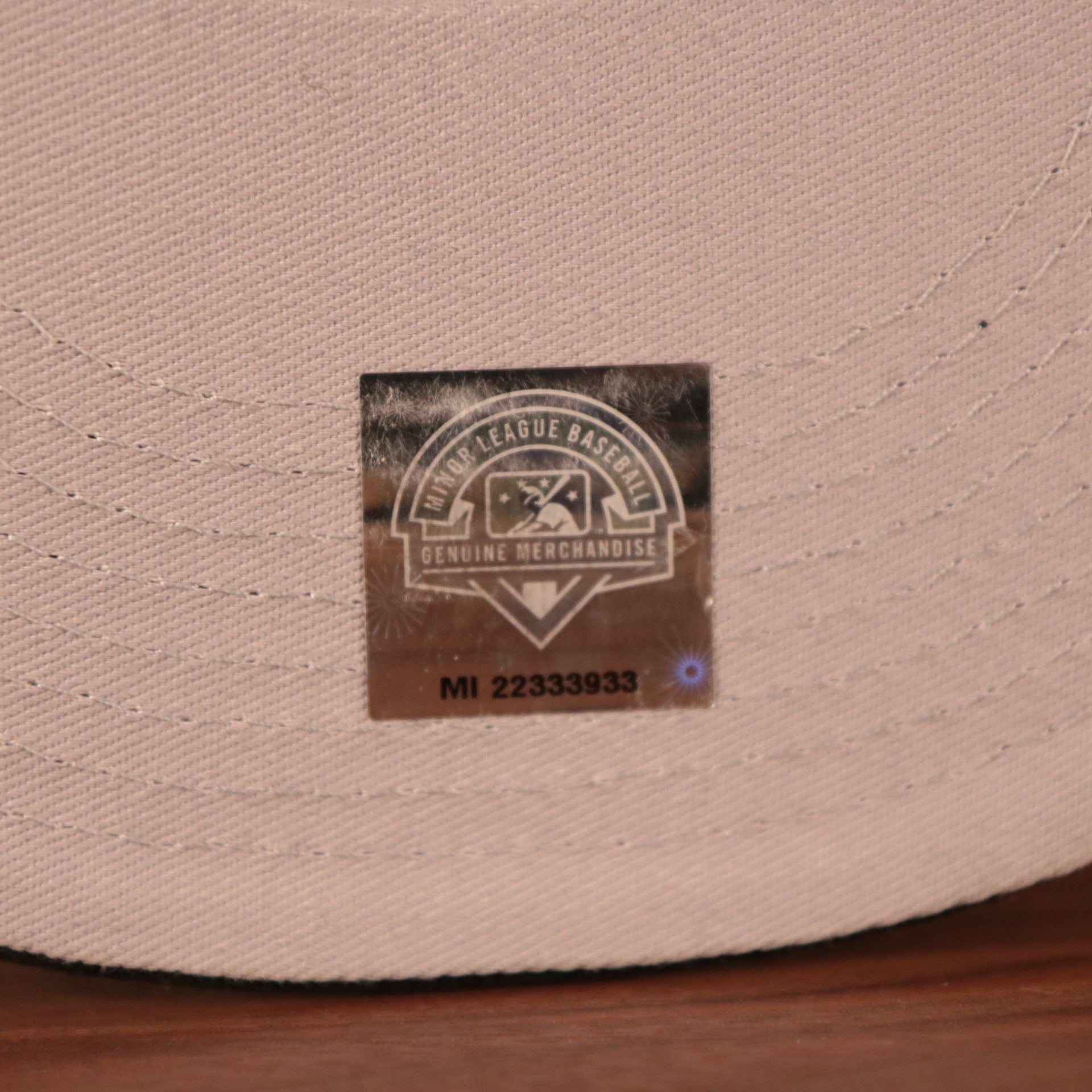 The MiLB genuine merchandise patch on the grey underbrim fitted Philly Cheesesteak with onions cap.