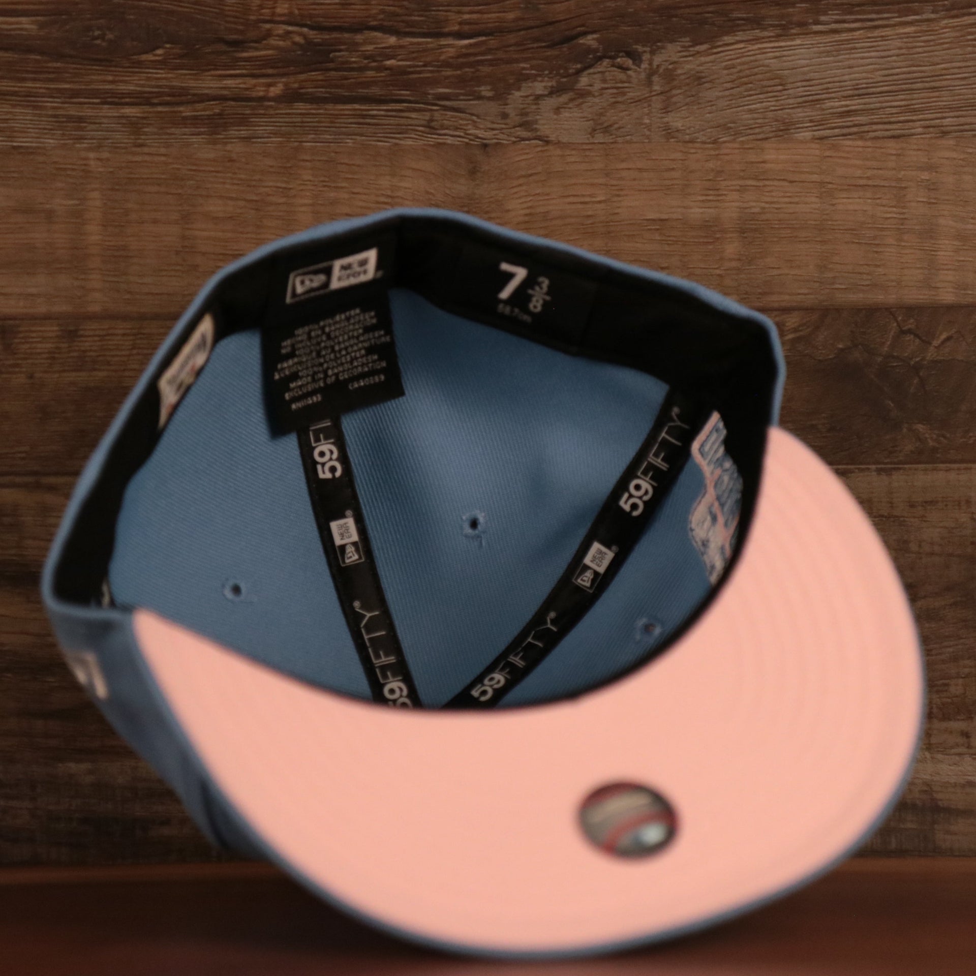 The pink underbrim fitted vintage Philadelphia Phillies side patch hat by New Era.