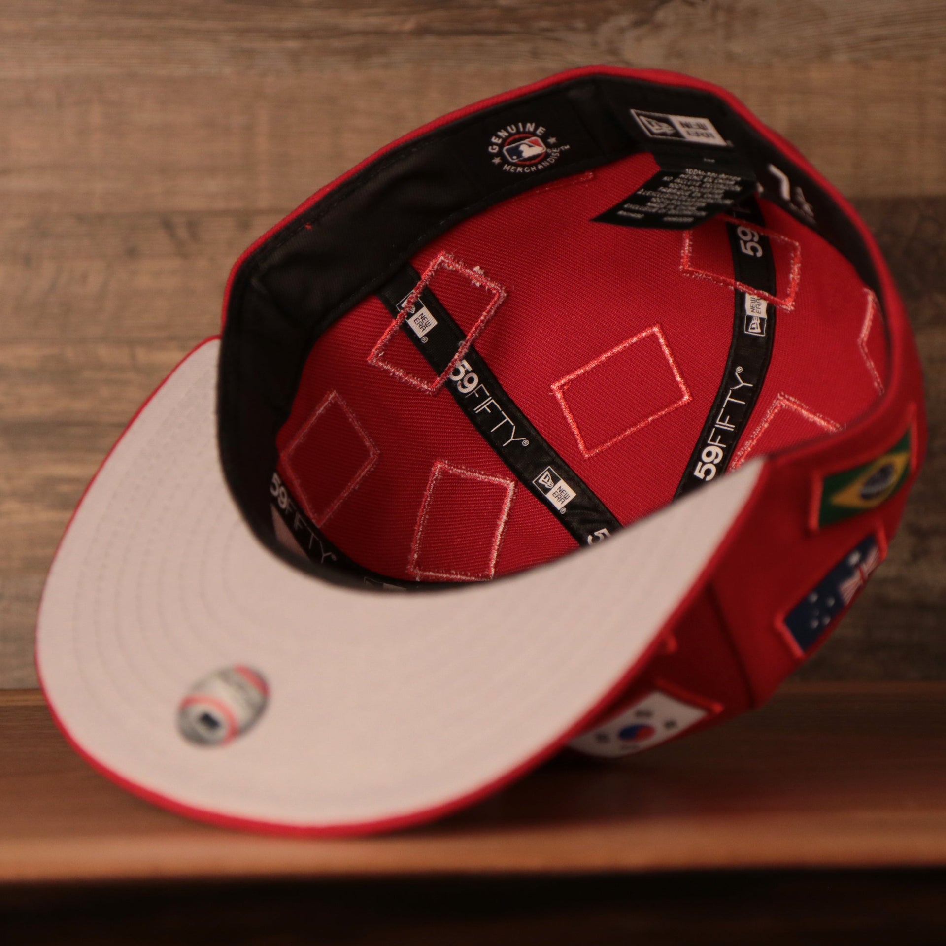 the inside of this phillies world fitted cap has a black sweatband Phillies World Flags Gray Bottom Fitted Cap | Philadelphia Phillies International Flags Red Grey Under Brim Fitted Cap