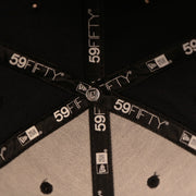 New Era Logo button which is visible upclose on this 59Fifty Yankees on field Cap