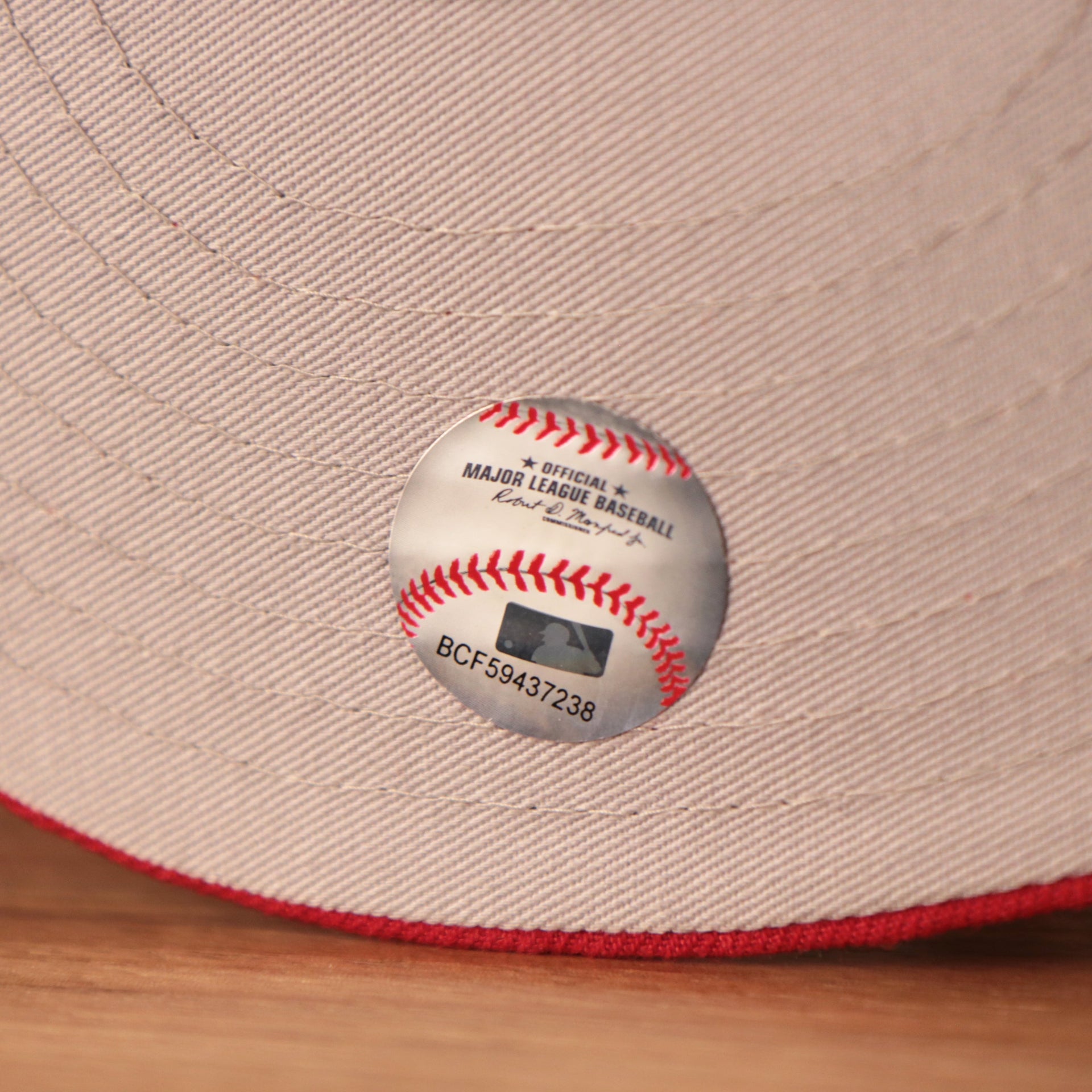 thgray underbrim has the MLB shiny sticker Phillies World Flags Gray Bottom Fitted Cap | Philadelphia Phillies International Flags Red Grey Under Brim Fitted Cap