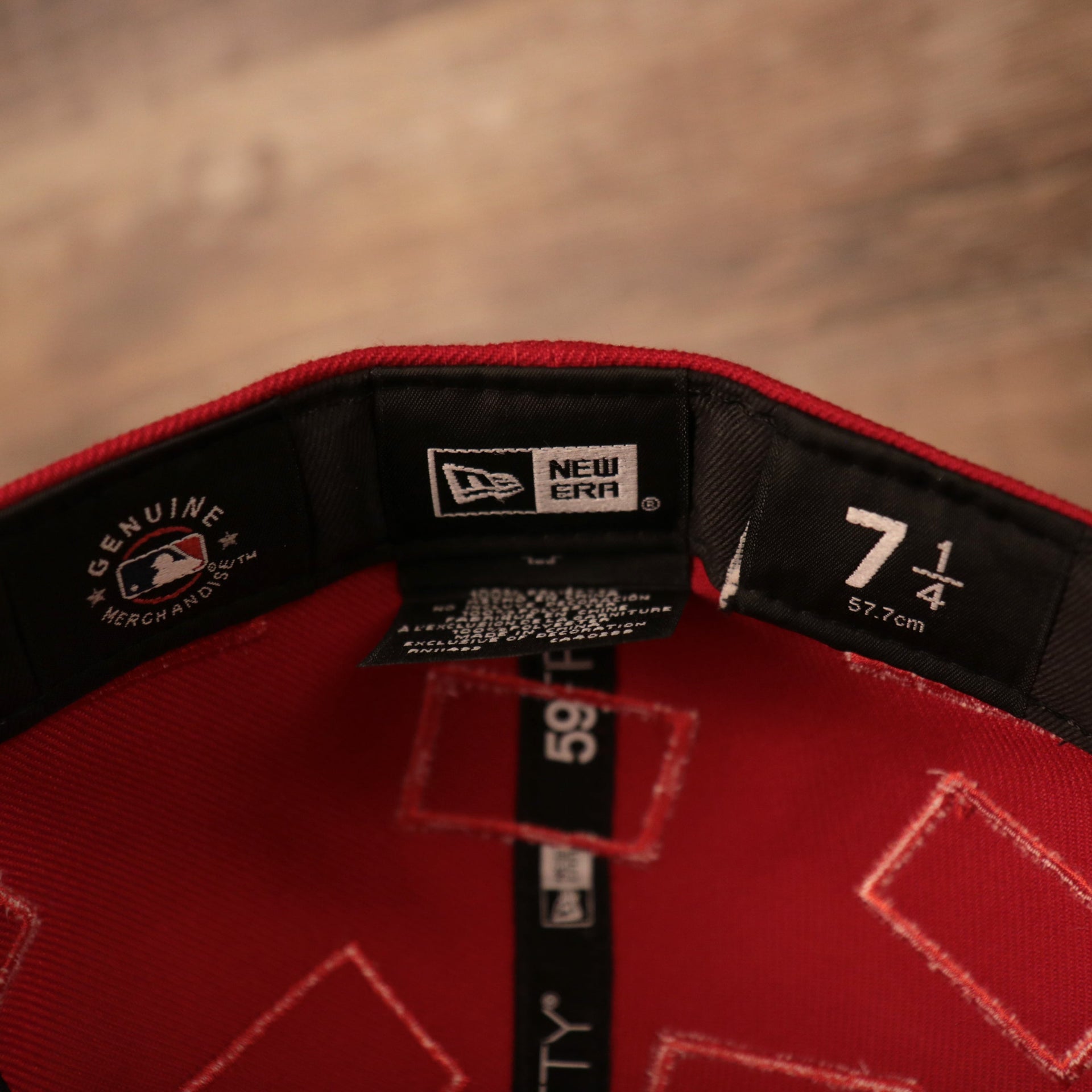 the new era tag on the inside is black Phillies World Flags Gray Bottom Fitted Cap | Philadelphia Phillies International Flags Red Grey Under Brim Fitted Cap