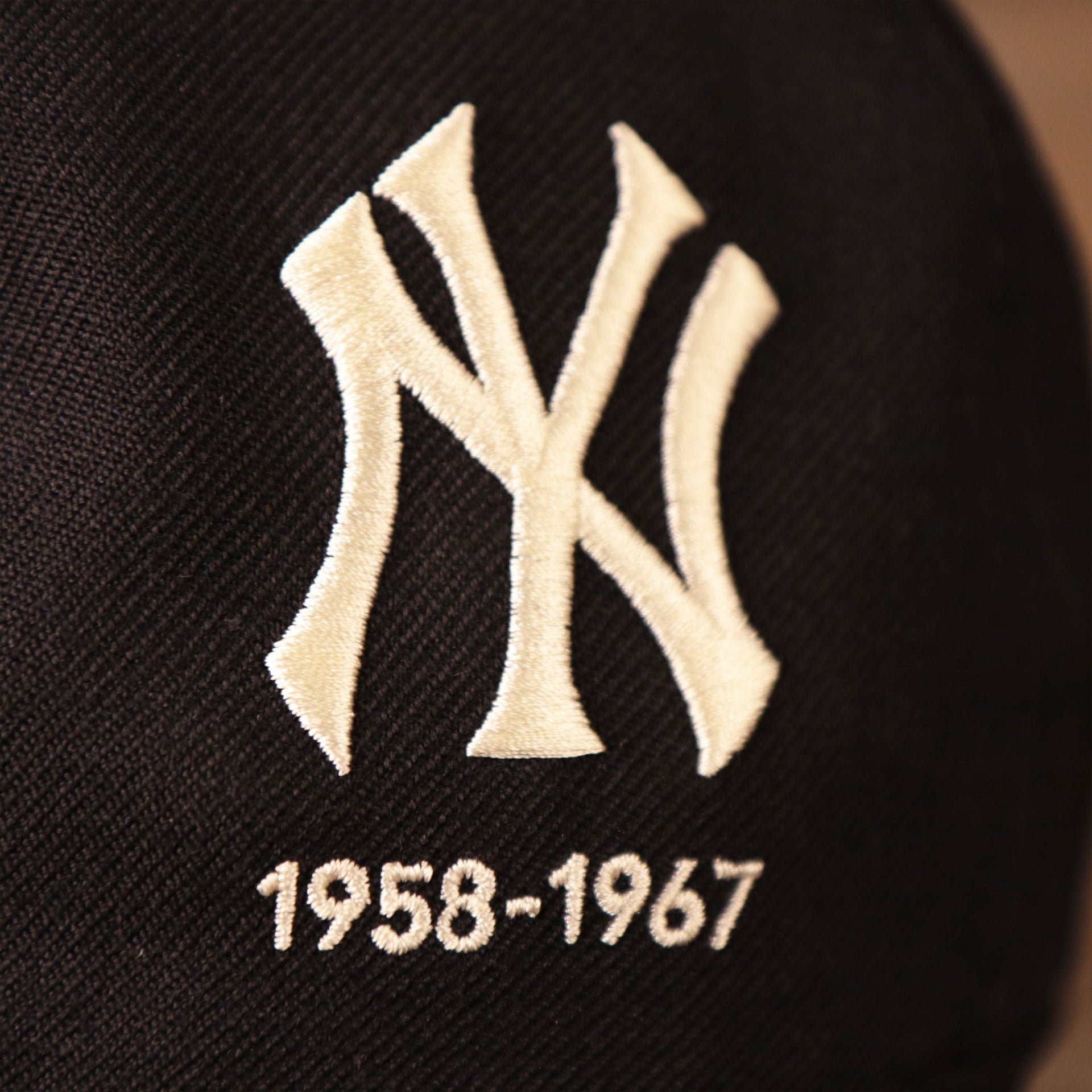 Bronx Bombers vintage logo on the navy New Era 59fifty with an all-over logo history design.