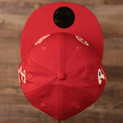 The crown of the red New Era 59fifty designed for the fighting Phils with all over logo history design.