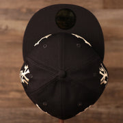 A navy 59fifty patch hat by New Era in a vintage design with all-over logo history of the Yankees.