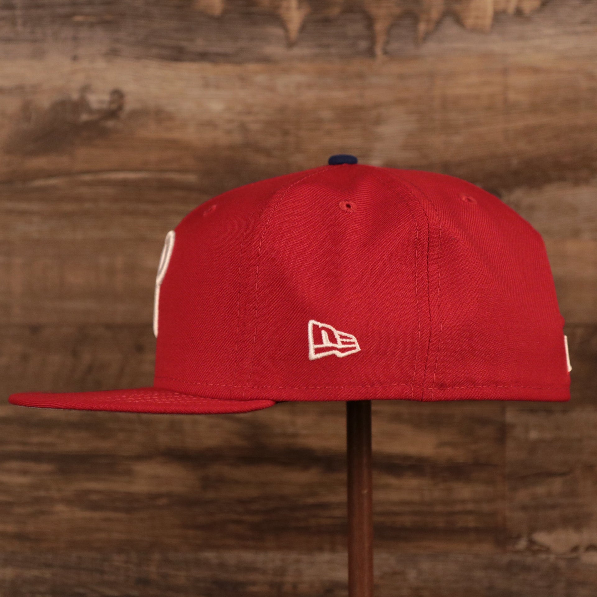 The wearer's left side of the Philadelphia Phillies 2008 World Series side patch fitted hat has the New Era logo in white.