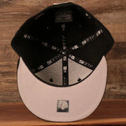 The inside of the crown of the MiLB Philly Cheesesteak with onions black New Era fitted cap.