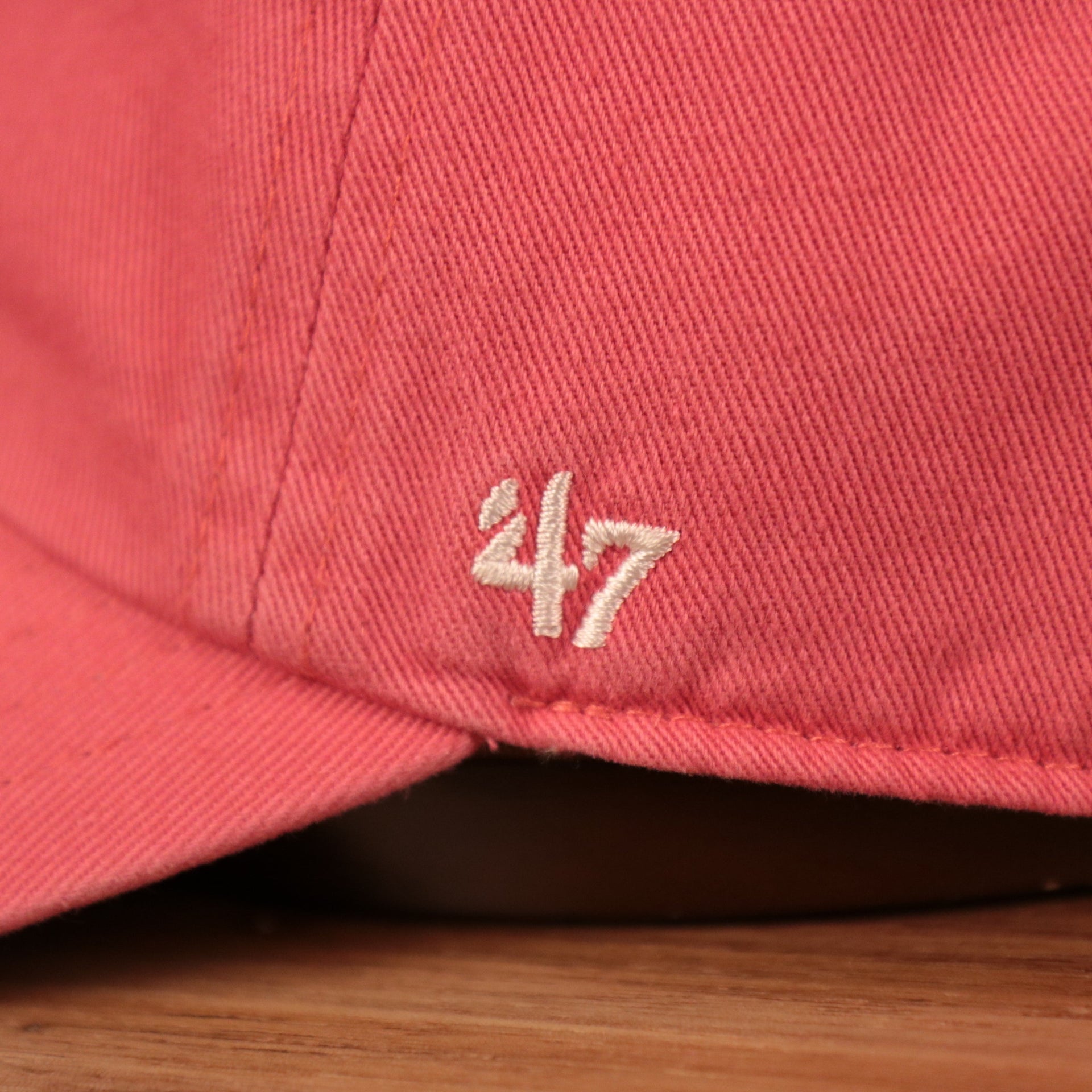 The wearer's left side of the dodgers green bottom dad hat has the logo of 47 Brand.