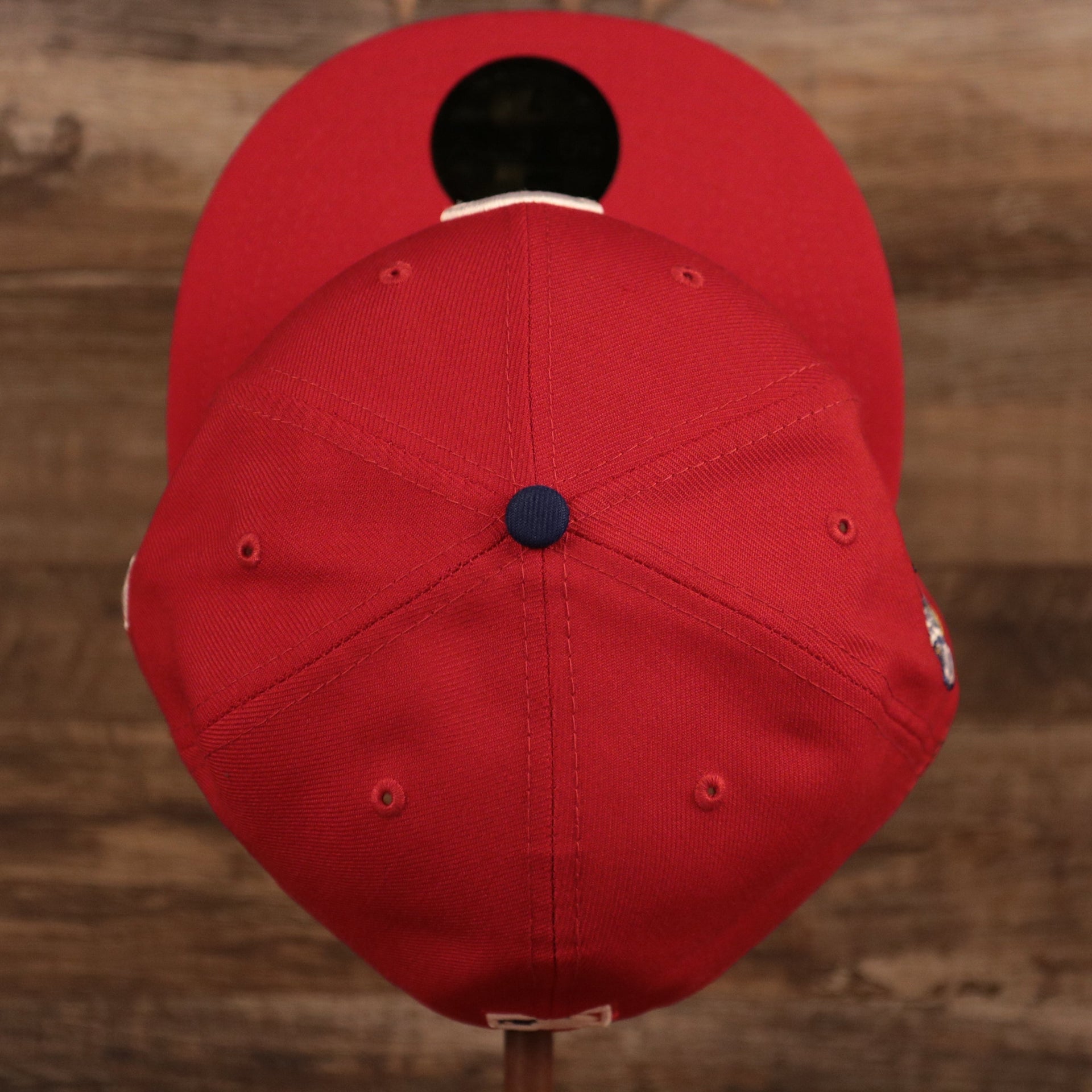 The top view of the crown of the red Phillies 2008 World Series grey bottom fitted cap.