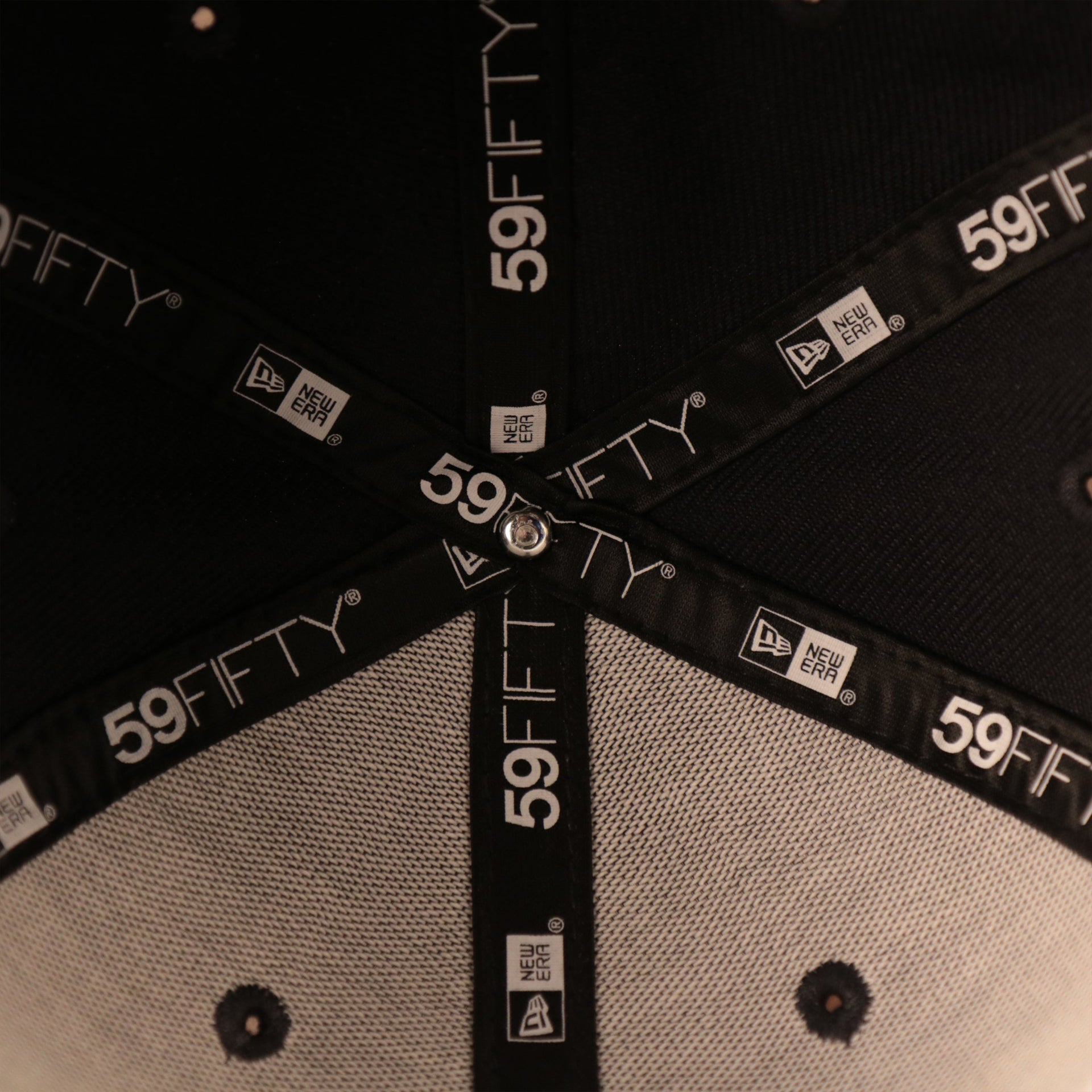 The logo of New Era 59fifty on the inside of the navy logo history patch fitted hat.