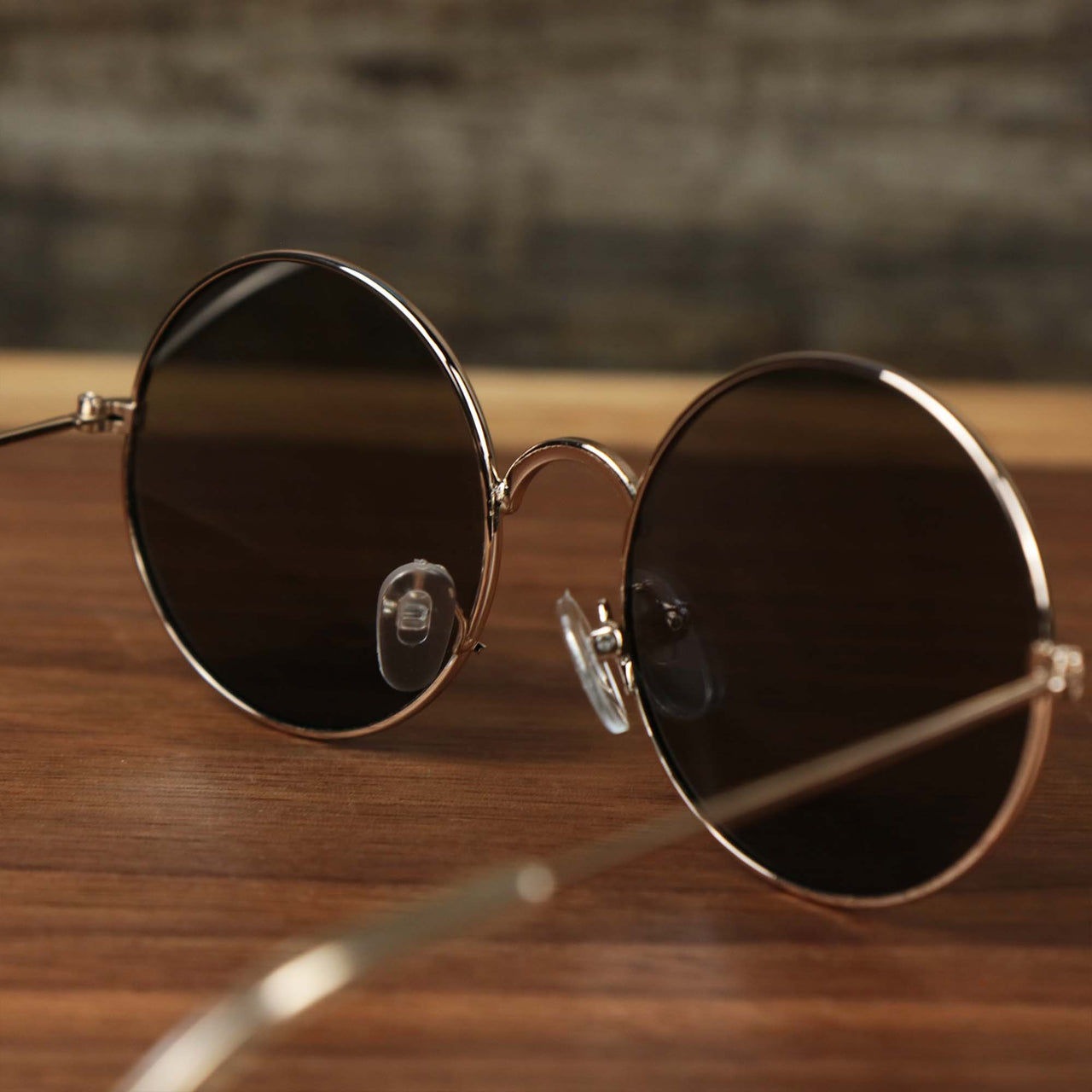 The inside of the Youth Round Frame Blue Lens Sunglasses with Rose Gold Frame