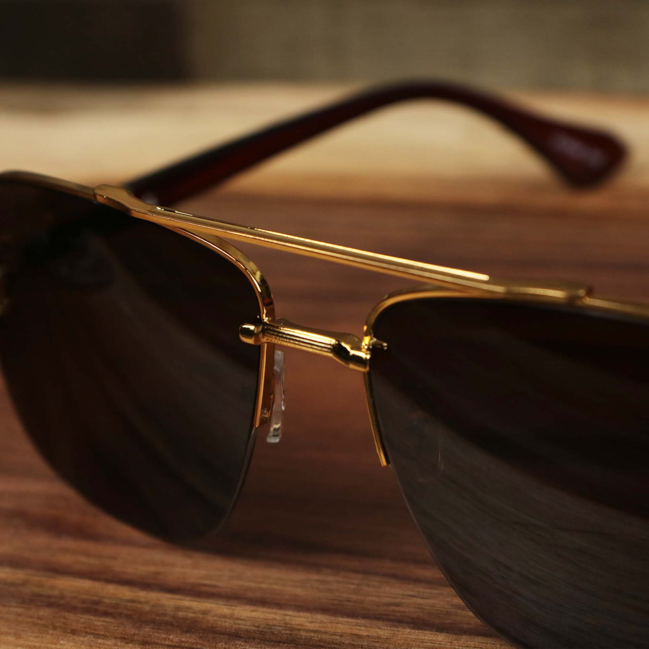The bridge on the Round Rectangle Frame Brown Lens Sunglasses with Gold Frame