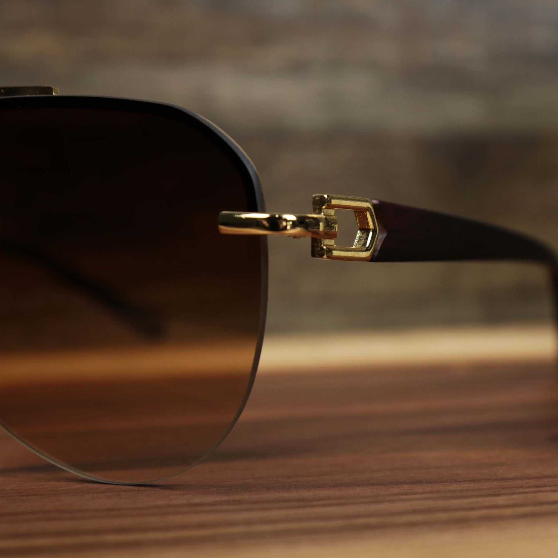 The hinge on the Round Aviator Frames Brown Gradient Lens Sunglasses with Gold Frame