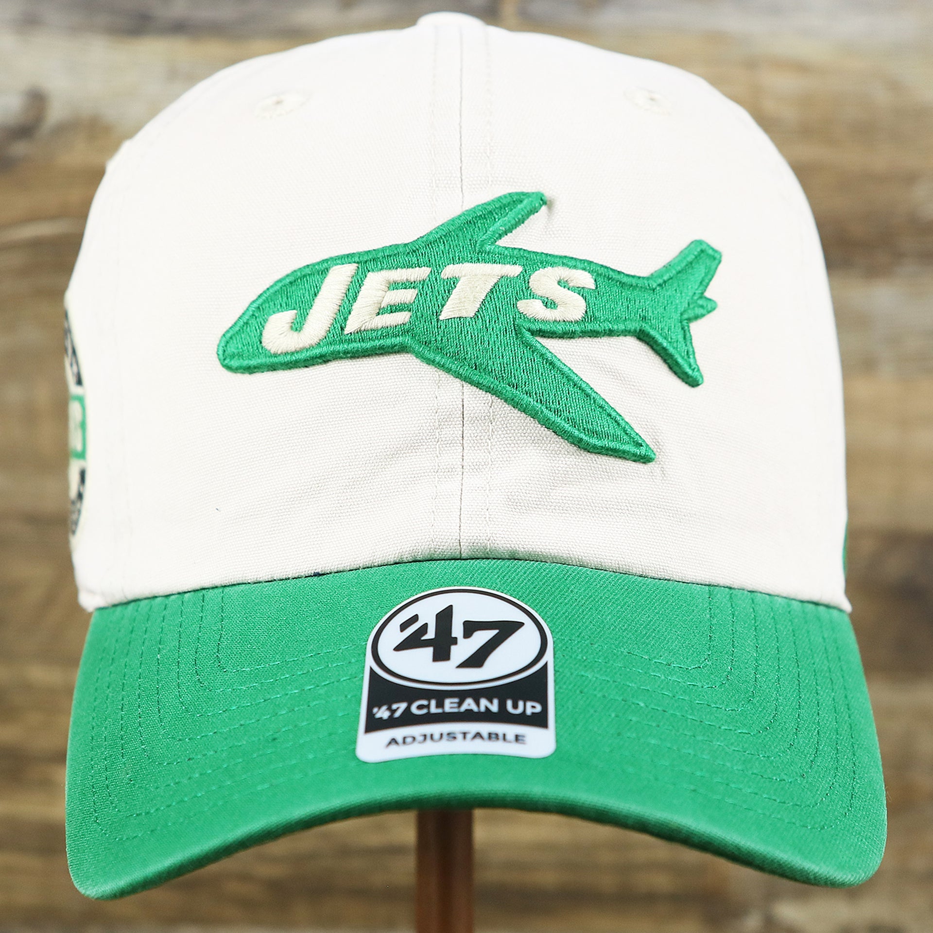 The front of the Throwback New York Jets Embroidered 1963 Jets Logo NFL Jets Side Patch Dad Hat | Bone Dad Hat