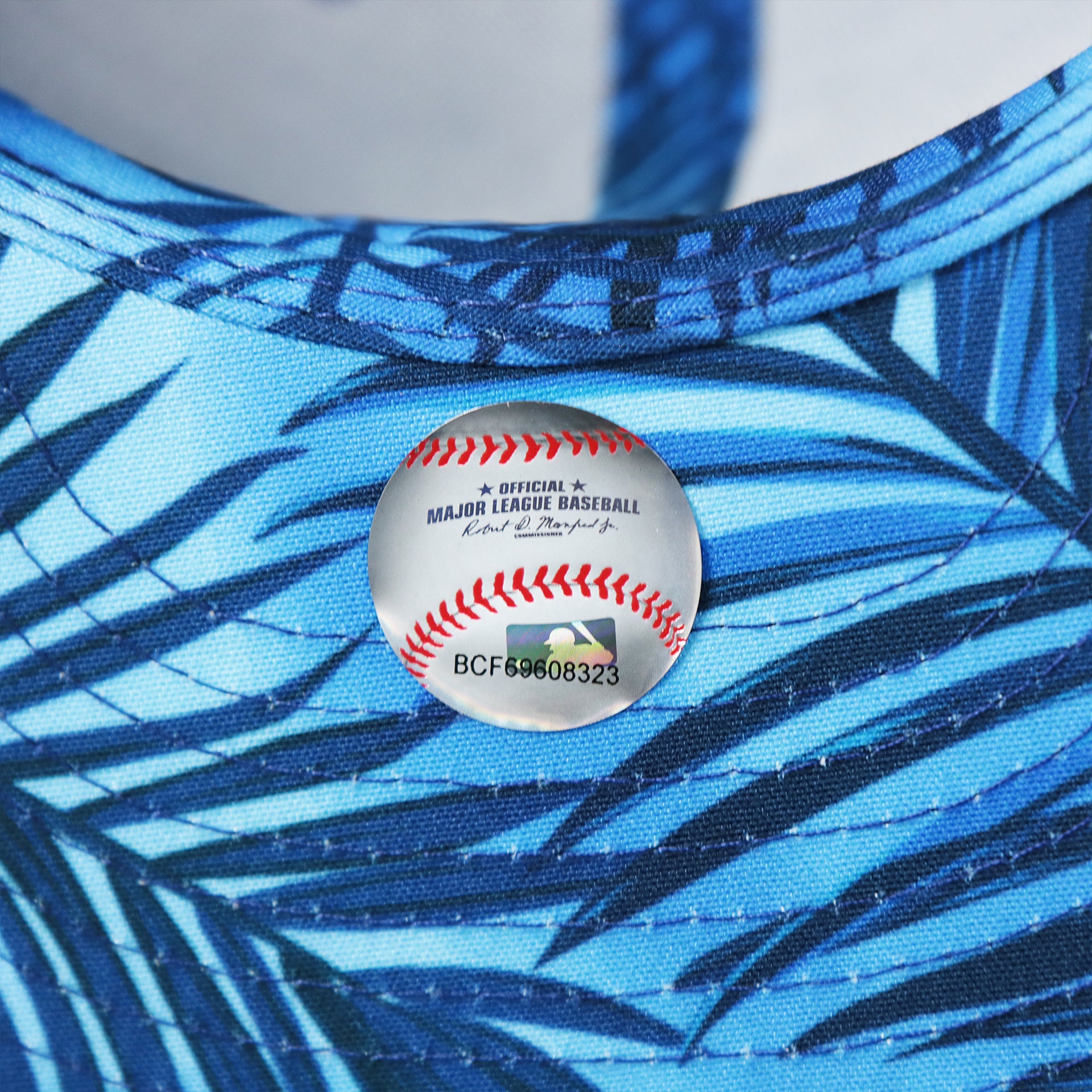 The MLB Sticker on the Los Angeles Dodgers Metallic All Star Game MLB 2022 Side Patch 9Fifty Mesh Snapback | ASG 2022 Royal Blue Trucker Hat