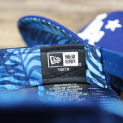 The New Era Youth Tag on the Youth Los Angeles Dodgers MLB 2022 All Star Game Mesh Back 9Fifty Snapback Cap | ASG 2022 Royal Blue Trucker Hat