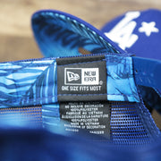 The New Era Tag on the Los Angeles Dodgers Metallic All Star Game MLB 2022 Side Patch 9Fifty Mesh Snapback | ASG 2022 Royal Blue Trucker Hat