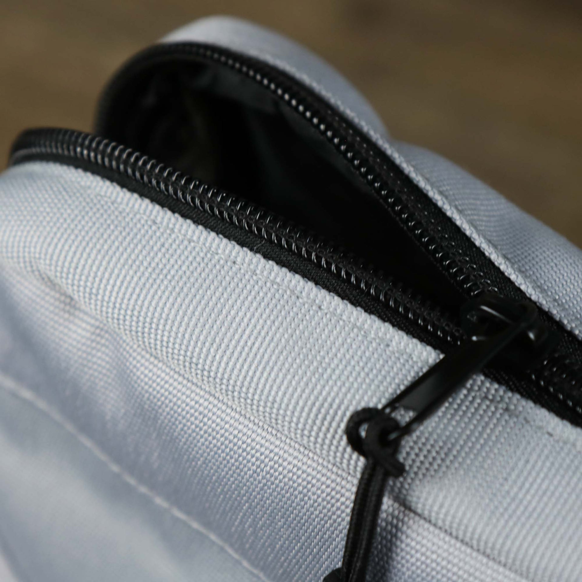 The main zipper open on the Essential Nylon Shoulder Bag Streetwear with Mesh Pocket | Official Gray