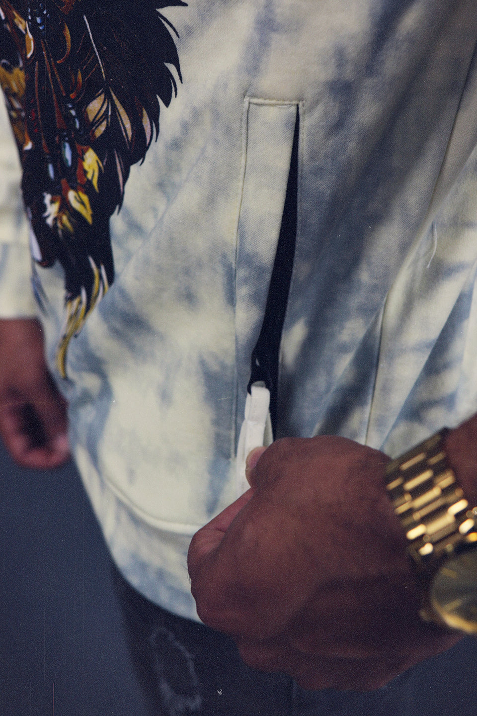 A close up of the zipper pocket on the Men's Chieftain Skull Hype Beast Streetwear Sequin Graphic Crewneck Sweatshirt