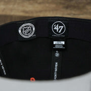 The Tags on the Philadelphia Flyers Side Patch Dugout Side Defender Fitted Cap | Black Stretch Fitted Cap