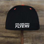 The backside of the Philadelphia Flyers Side Patch Dugout Side Defender Fitted Cap | Black Stretch Fitted Cap