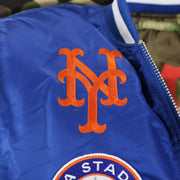 The New York Mets Logo Embroidered on the New York Mets MLB Patch Alpha Industries Reversible Bomber Jacket With Camo Liner | Royal Blue Bomber Jacket