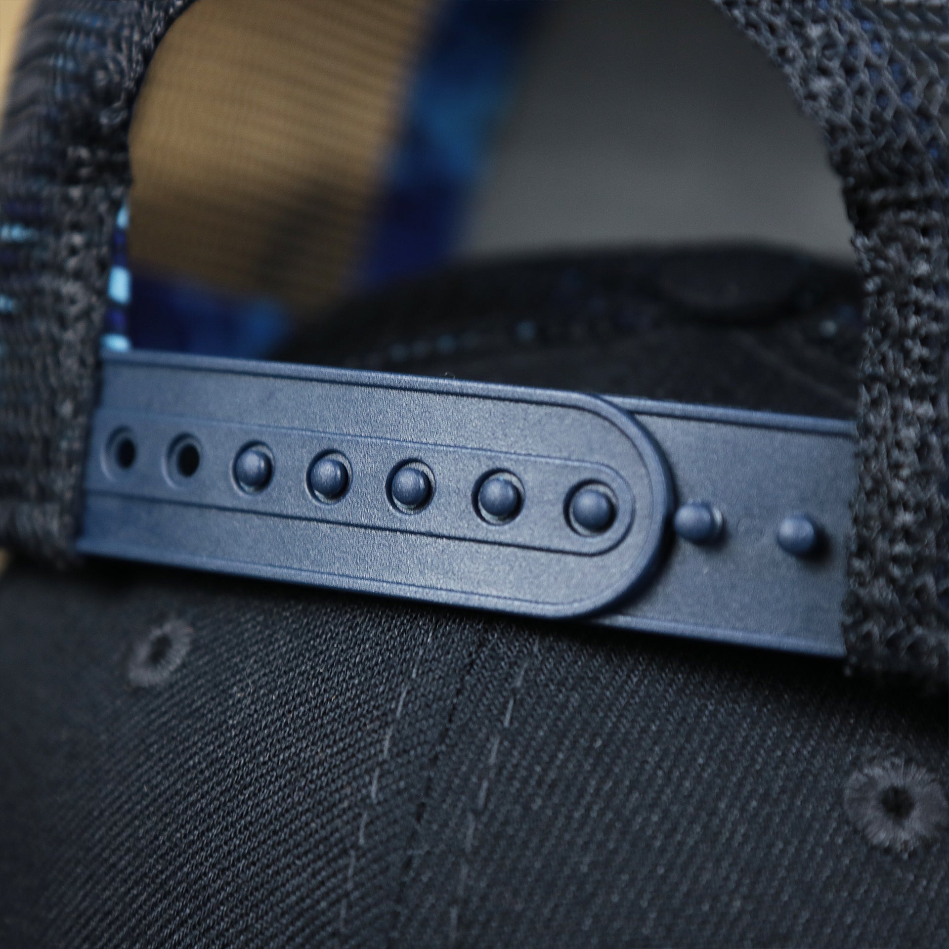 The Navy Adjustable Strap on the New York Yankees Metallic All Star Game MLB 2022 Side Patch 9Fifty Mesh Snapback | ASG 2022 Navy Blue Trucker Hat