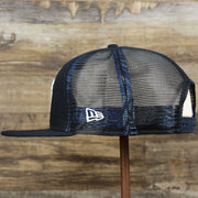 The wearer's left on the New York Yankees Metallic All Star Game MLB 2022 Side Patch 9Fifty Mesh Snapback | ASG 2022 Navy Blue Trucker Hat