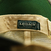 The legacy Tag on the Ocean City New Jersey Since 1897 Helm Patch Camo Print Mesh Back Trucker Hat | Camo Navy Blue Trucker Hat