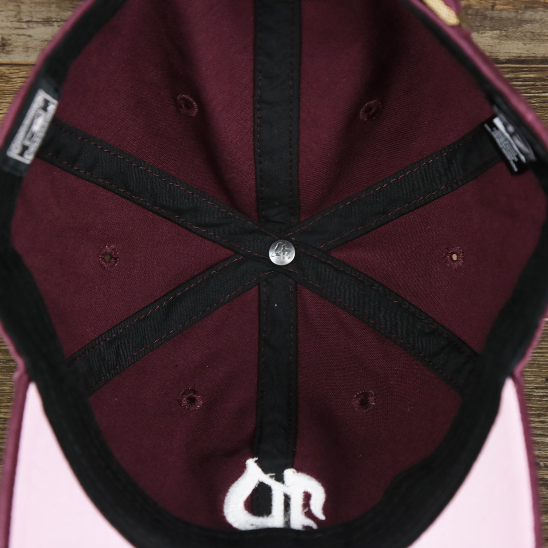 The inside of the Cooperstown Philadelphia Phillies Vintage 1910s Phillies Logo Dad Hat | Dark Maroon Dad Hat