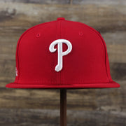 The front of the Philadelphia Phillies Alpha Industries Side Patch Army Green Undervisor 59FIfty Fitted Cap With Hangtag | Red 59FIfty Cap