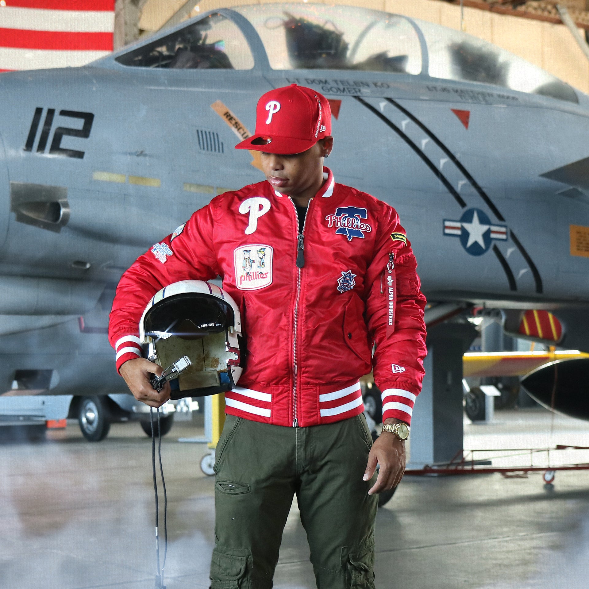 The Philadelphia Phillies MLB Patch Alpha Industries Reversible Bomber Jacket With Camo Liner | Red Bomber Jacket with a matching helmet